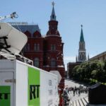 Vehicles of Russian state-controlled broadcaster Russia Today are seen near the Red Square in central Moscow