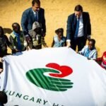 Hungary Helps, Azbej Trisztán